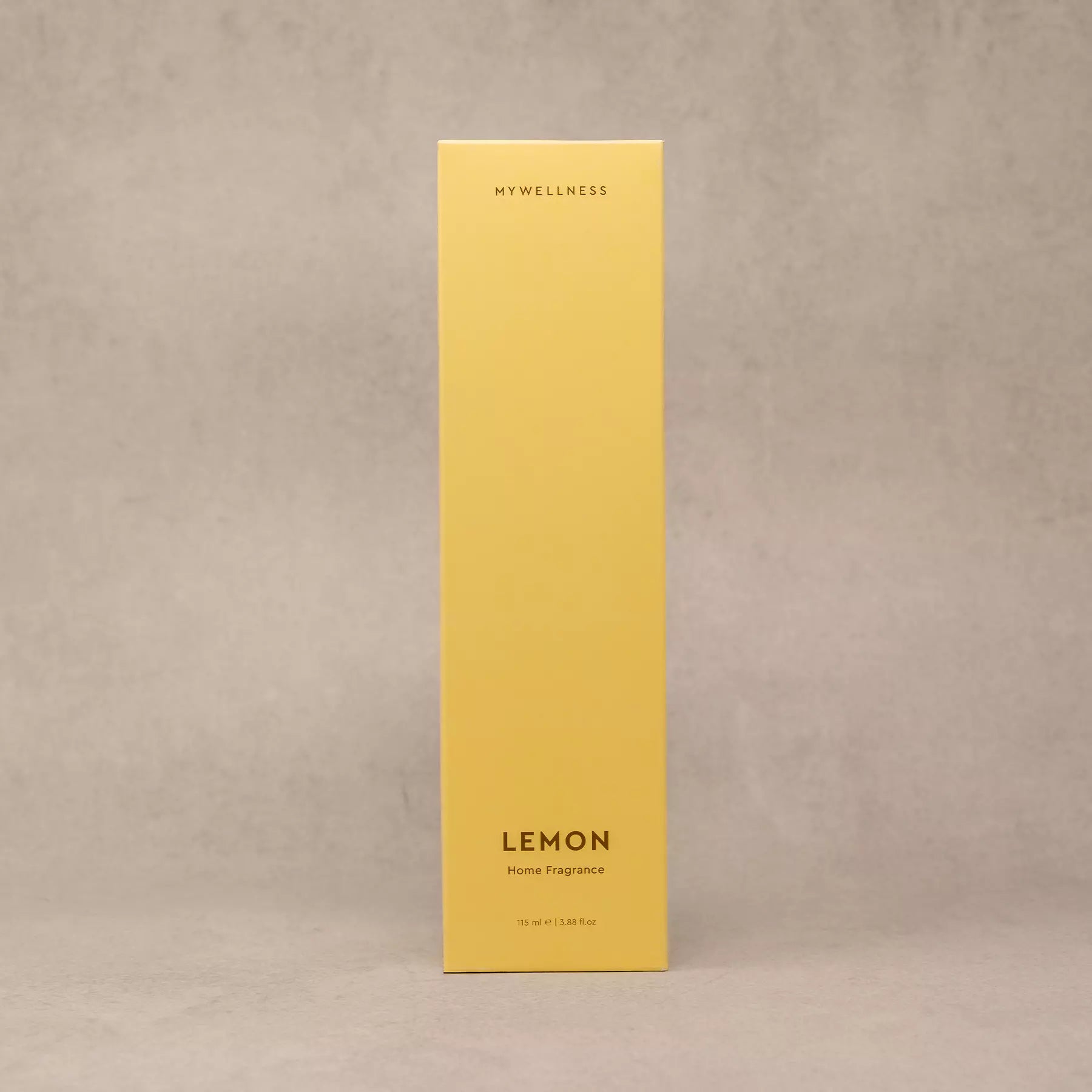 Gelbe Verpackung des Lemon Raumdufts vor neutralem Hintergrund